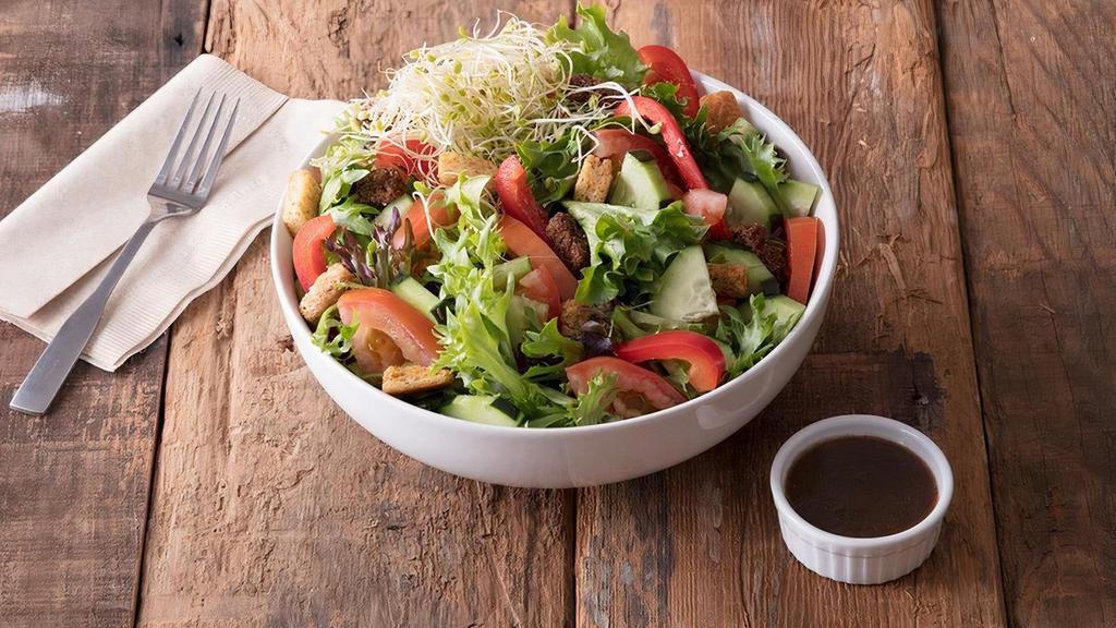 Regular House Salad · Garden salad mix with tomato, cucumber, red bell pepper, clover sprouts, and topped with fresh baked croutons.  Served with your choice of dressing. . 120 Cal