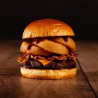 The Bacon BBQ Burger · Beef patty, bacon, fried onion rings, BBQ sauce, and melted cheddar cheese on a bun.