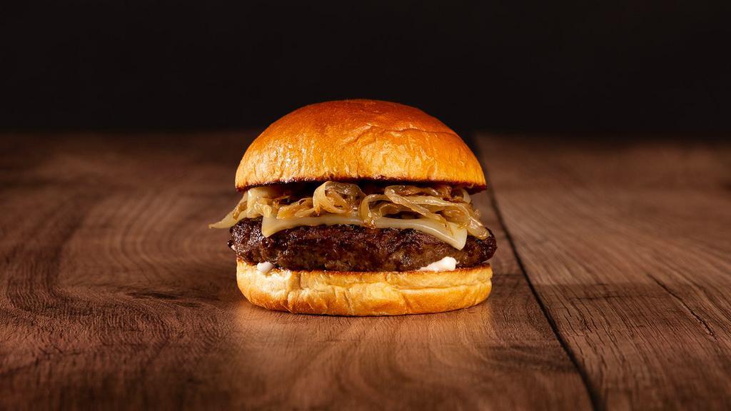 The Truffle Burger · Beef patty, caramelized onions, truffle mayo, and melted swiss cheese on a bun.