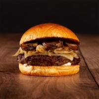 The Mushroom Swiss Cheeseburger · Beef patty, roasted mushrooms, caramelized onions, melted swiss cheese, and mayo on a bun.