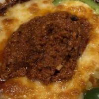 Queso Fundido · Queso oaxaca, real mexican cheese, mixed with jack cheese and melted to perfection. Served w...