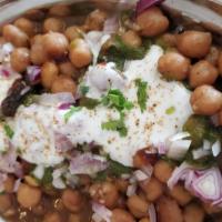 Aloo Tikki Chaat (2 Pcs) · Potato patties pan-fried served with chickpeas, yogurt, onions, tangy sauce topped with fres...