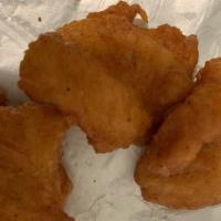 Fish Pakora · Fish dipped in chickpeas flour and deep-fried.