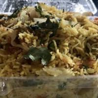 Veg Biryani · Madily of succulent vegetables, spices, ghee, saffron & flavourful Basmati Rice.