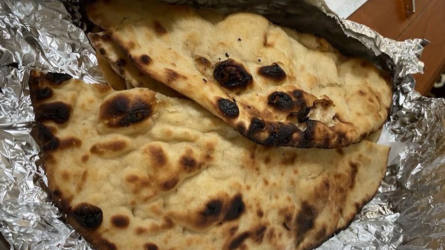 Plain Naan · Leavened, oven-baked bread.