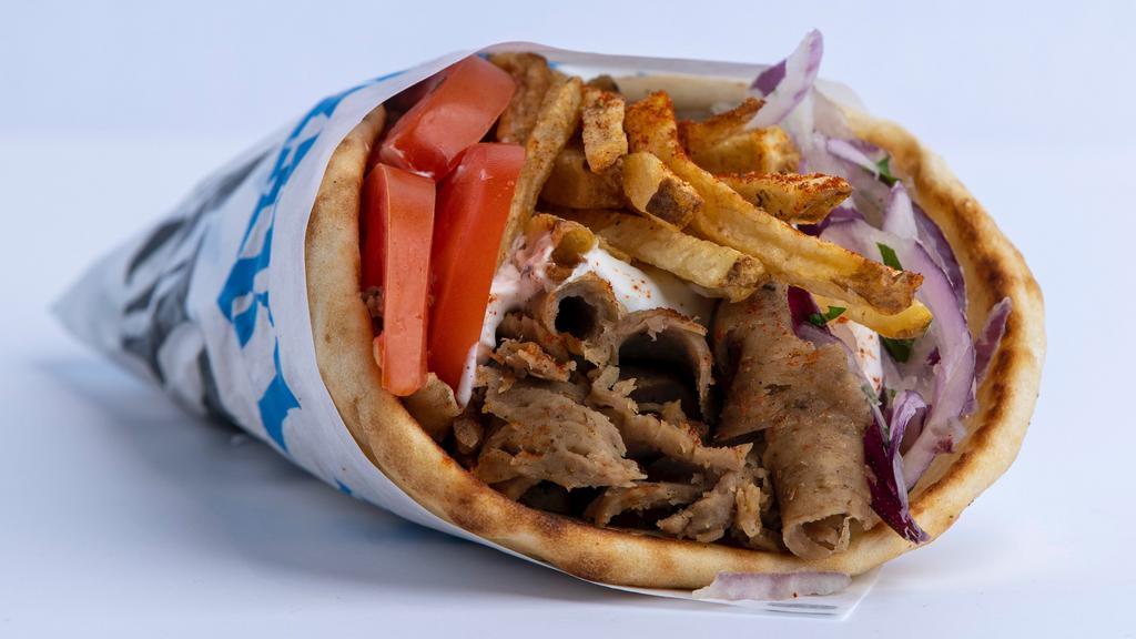 Beef/Lamb Gyro Pita · A seasoned beef and lamb mix, cooked on a vertical rotisserie, served on a warm pita bread filled with fries, tomatoes, onions and tzatziki sauce.