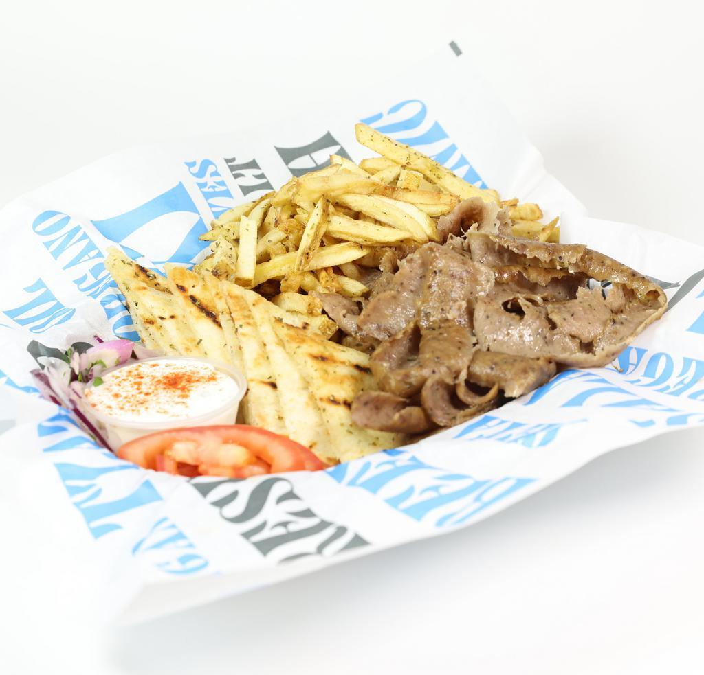Gyro Plate · Any one of our three gyro meats (beef/lamb, pork, or chicken) served with french fries, Greek salad, tzatziki sauce and pita bread.