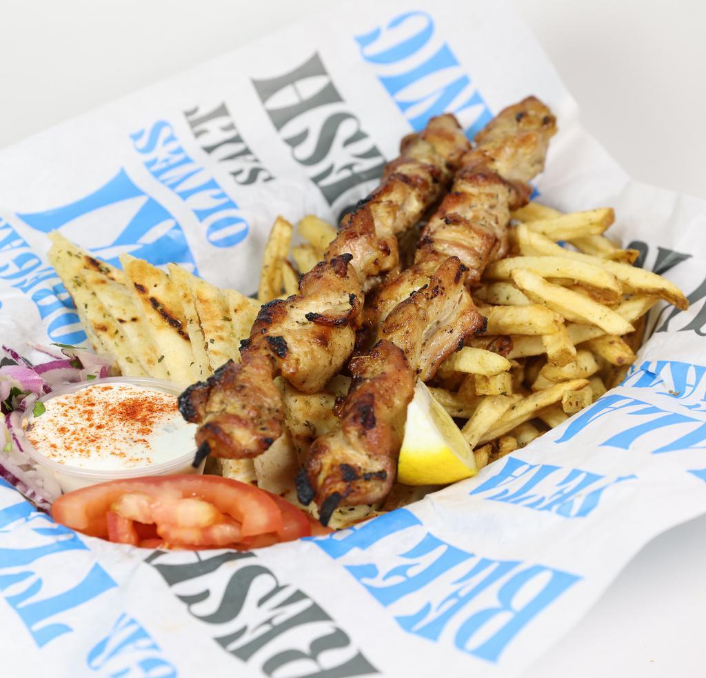Chicken Souvlaki Plate · Fresh cut chicken, skewered and seasoned with Greek spices, cooked over open flame, served with french fries, Greek salad, tzatziki sauce and pita bread.