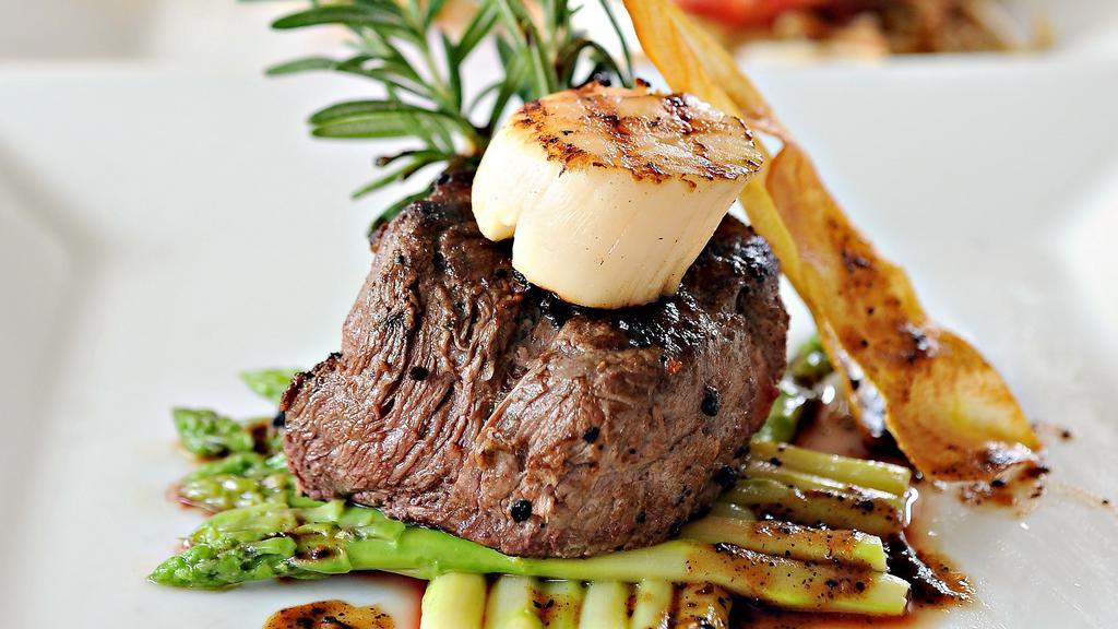 Filet Mignon & Scallops · Tasty and oh-so Tender Filet Mignon that just melts in your mouth, paired with flavorful Scallops cooked to perfection. Comes with Steamed Sautéed Vegetables and your choice of Creamy Mashed Potatoes with Gravy or Roasted Yams.