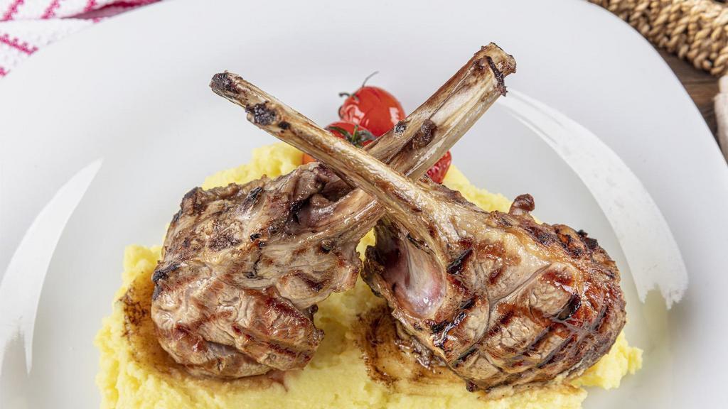 Lamb Rack Plate · Grilled and Seasoned Lamb Rack cooked to perfection. Comes with Steamed Sautéed Vegetables and your choice of Creamy Mashed Potatoes with Gravy or Roasted Yams.