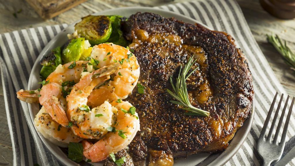 Ribeye Steak & Shrimp · Juicy Ribeye Steak rich in flavor alongside Flavorful Shrimp. Comes with Steamed Sautéed Vegetables and your choice of Creamy Mashed Potatoes with Gravy or Roasted Yams.