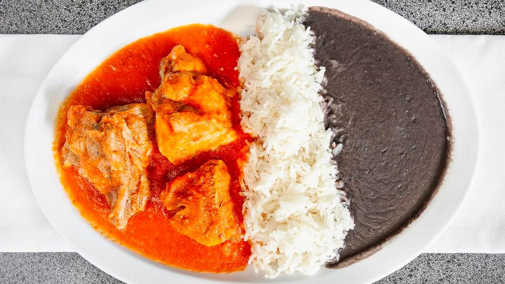 Entomatado de Puerco · Tomato sauce with pork. Served with fried black beans, rice. 6 freshly handmade tortillas included.