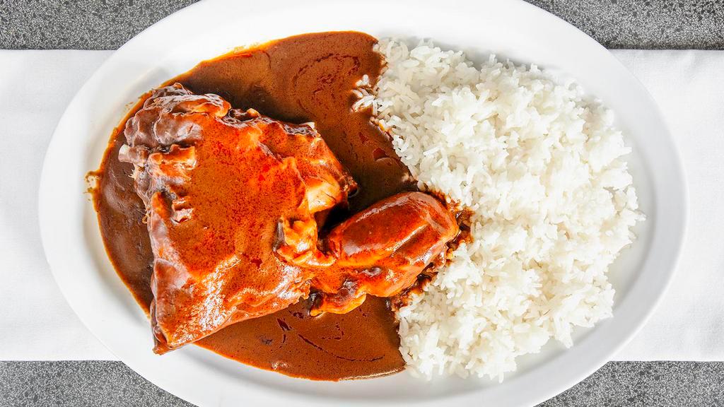 Mole · Chicken with spicy mole sauce. Served with rice and 6 freshly handmade tortillas included.