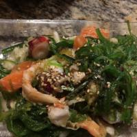 Japanese Seafood Salad · Octopus, salmon, shrimp, seaweed salad, pickled cabbage, cucumber.