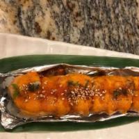 Lion King Roll · Crab, avocado, salmon sashimi on top and oven baked.