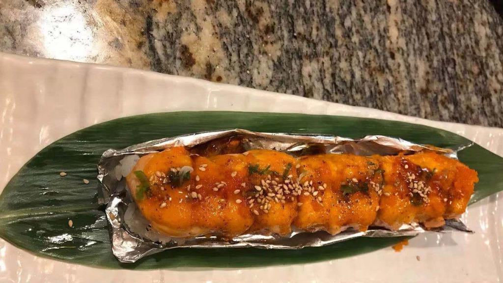 Lion King Roll · Crab, avocado, salmon sashimi on top and oven baked.