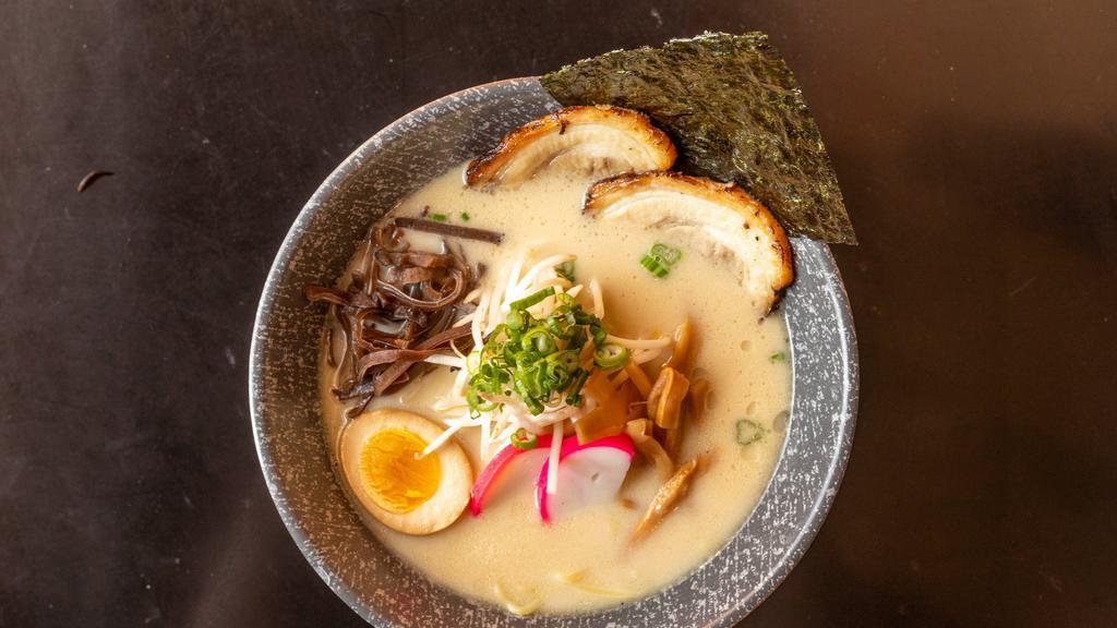 Tonkotsu Ramen · Roasted pork, boiled egg, kikurage mushroom, bamboo shoots, green onion, sprouts, fish cake, roasted seaweed.