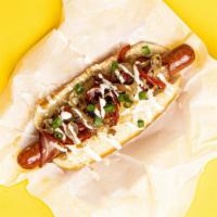 LA Dog · Bacon wrapped dog topped with sauteed onions and peppers, and sliced scallions, served on a ...