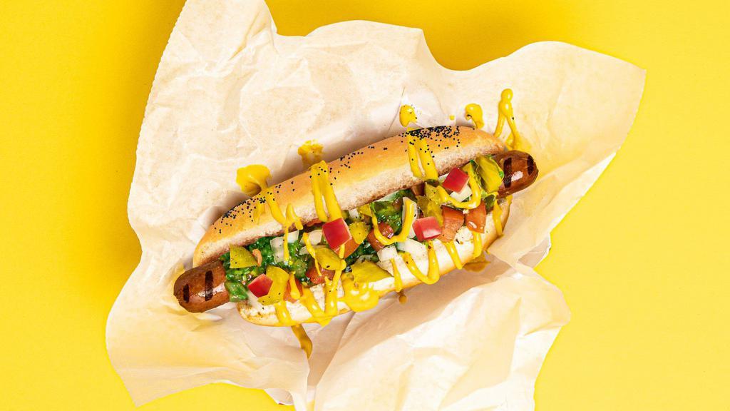 Chicago Dog · Hot dog topped with relish, mustard, diced white onion, tomato, and pickles, served on a fluffy bun.