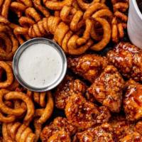 22  Boneless Wings Combo · 22 boneless wings  tossed with your choice of 2 flavors. Served with curly fries, a side of ...