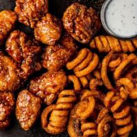 11 Boneless Wings · 11 boneless wings, served with curly fries & a side of ranch.