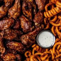 32 Smoked Bone-In Wings · 32 bone-in wings smoked in-house over pecan wood then tossed with your choice of 4 flavors. ...