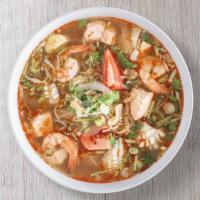Hot-N-Sour Seafood · Hot and sour seafood broth served with shrimp, salmon, squid, and pineapple chunks.
