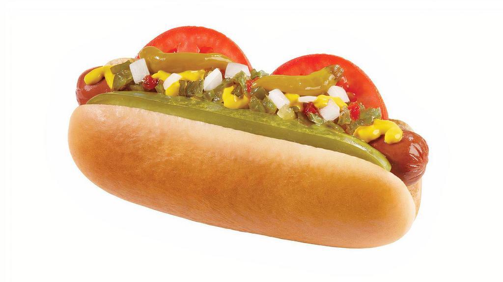 Chicago Veggie Dog · A Veggie Dog in a fresh, steamed bun topped with tomato, chopped onions, pickle spear, relish, sport peppers, yellow mustard and sprinkled with celery salt just like in Chicago!