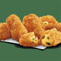 Jalapeño Poppers · Golden brown poppers stuffed with diced jalapeños and cheddar cheese. Comes with side of ran...