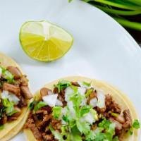 Tacos · Whole beans, onion, cilantro, radishes on the side and tomatillo sauce.( NO GREEN SAUCE)