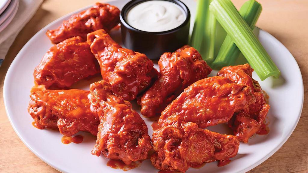 Double Crunch Bone-In Wings · Twice battered and fried, these crisp outside, tender inside wings are tossed in your choice of sauce.  Served with Bleu cheese or house-made ranch dressing with real buttermilk.