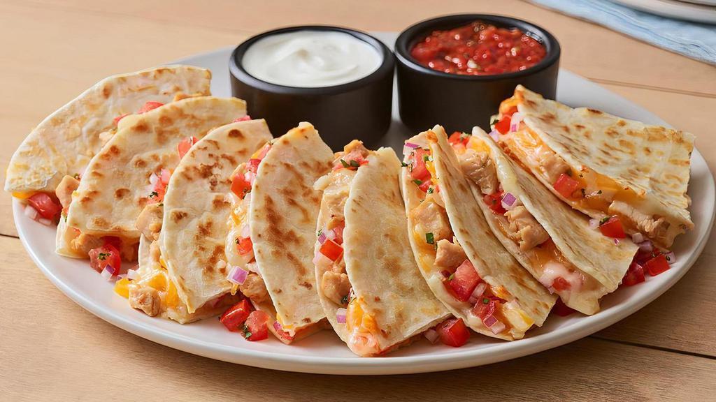Chicken Quesadilla · Warm, grilled tortillas are loaded with chipotle lime chicken, house-made pico de gallo and a blend of melted Cheddar cheeses. Served with our chipotle lime salsa and sour cream.