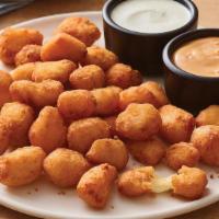 Crispy Cheese Bites · Golden, crispy and melty cheese bites, these favorites are served with house-made buttermilk...