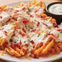 New Brew Pub Loaded Waffle Fries · Load up on fries and flavor with our crispy waffle fries topped with a blend of melted Chedd...