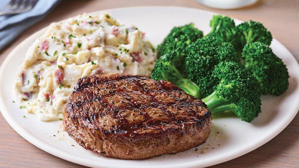 6 Oz. Top Sirloin* · Lightly seasoned USDA Select Top Sirloin* cooked to perfection and served hot off the grill.  Served with garlic mashed potatoes and steamed broccoli.