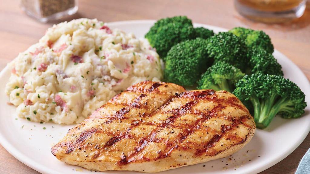 Grilled Chicken Breast · Juicy chicken breast seasoned and grilled over an open flame. Served with garlic mashed potatoes & broccoli.
