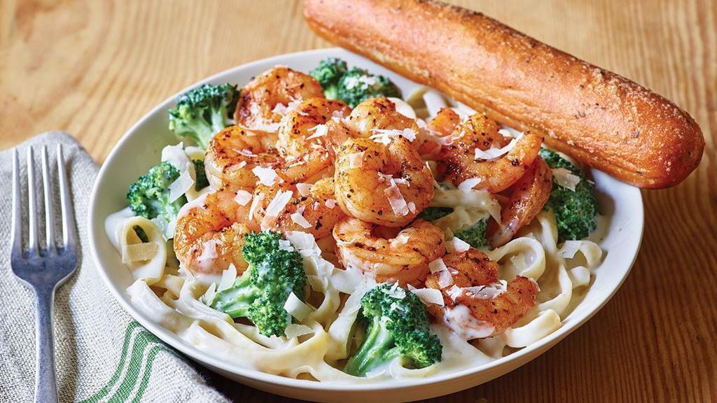 Classic Blackened Shrimp Alfredo · Blackened Shrimp is served warm on a bed of fettuccine pasta tossed with broccoli and rich Alfredo sauce topped with Parmesan cheese. Served with a golden brown signature breadstick brushed with buttery garlic and parsley.