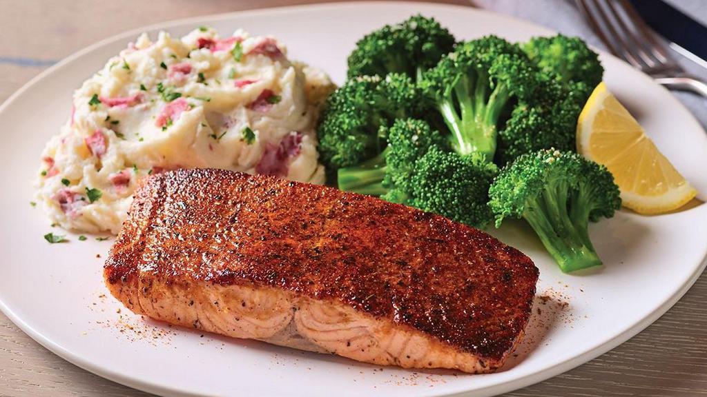 Blackened Cajun Salmon · 6 oz. blackened salmon fillet grilled to perfection. Served with garlic mashed potatoes and steamed broccoli.