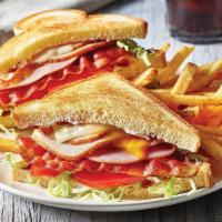 Clubhouse Grille ¥ · Sliced ham and turkey, Cheddar, Swiss, two strips of Applewood-smoked bacon, lettuce, tomato...
