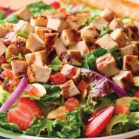 Strawberry Balsamic Chicken Salad · Tart, fresh and flavorful mixed greens with garden tomatoes, red onions, grilled chicken, sl...