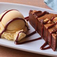 Brownie Bites · The perfect size of a warm dark chocolate brownie with nuts served with vanilla ice cream an...