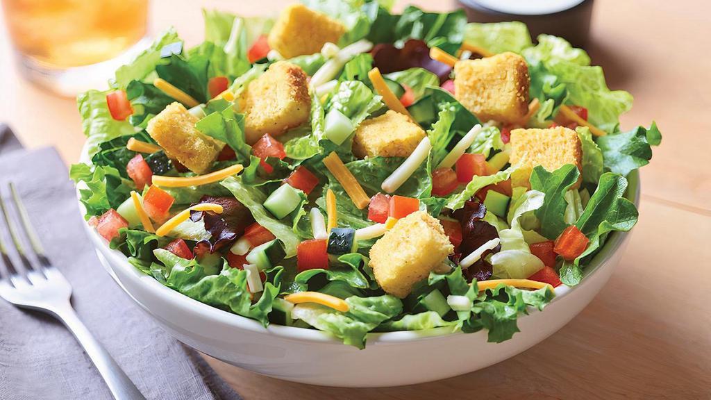 Side House Salad · Freshly mixed greens, cucumbers, diced tomatoes, cheese and croutons with your choice of dressing