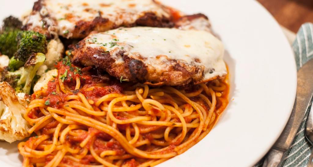 Chicken Parmesan · With mozzarella on top, served with sauteed spinach and spaghetti with marinara.