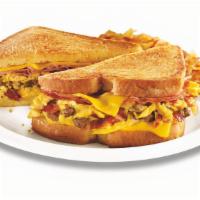 The Grand Slamwich® · Scrambled eggs, sausage, bacon, ham and American cheese on artisan bread grilled with a mapl...