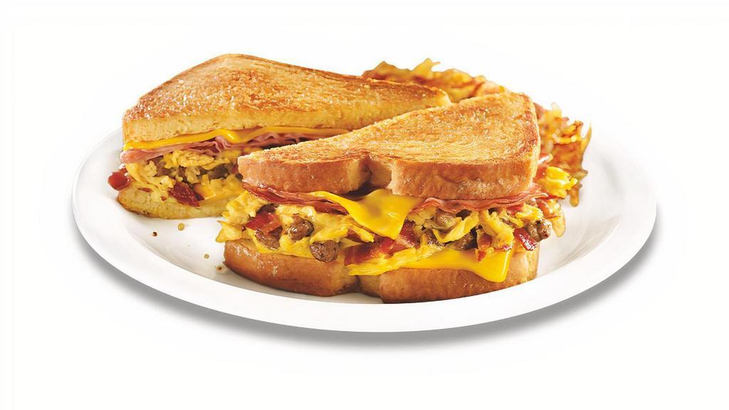 The Grand Slamwich® · Scrambled eggs, sausage, bacon, ham and American cheese on potato bread grilled with a maple spice spread. Served with hash browns.  .