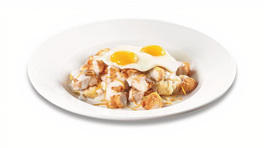 Chicken Biscuit & Gravy Bowl · Two open-faced biscuits topped with premium golden-fried chicken tenders, country gravy, cheddar cheese and two eggs*