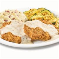 Country-Fried Steak  · Chopped beef steak smothered in country gravy. Served with two sides and dinner bread.  .