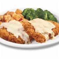 Plate Lickin' Chicken Fried Chicken · Golden-fried boneless chicken breasts smothered in country gravy. Served with two sides and ...