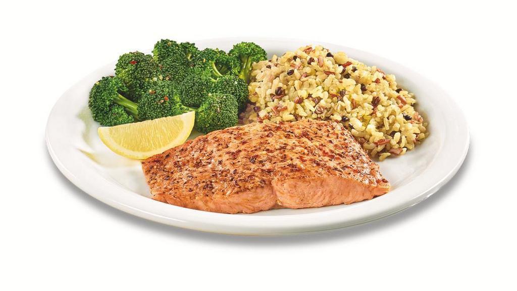 Wild Alaska Salmon · A grilled wild-caught Alaska salmon fillet with a delicious blend of garlic & herbs. Served with two sides and dinner bread.