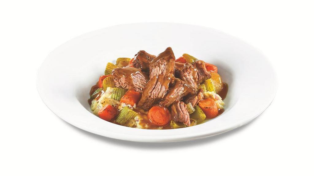 Mama D'S Pot Roast Bowl · Slow-cooked pot roast atop red-skinned mashed potatoes with roasted carrots, celery and onions all covered in rich gravy. Served with dinner bread.